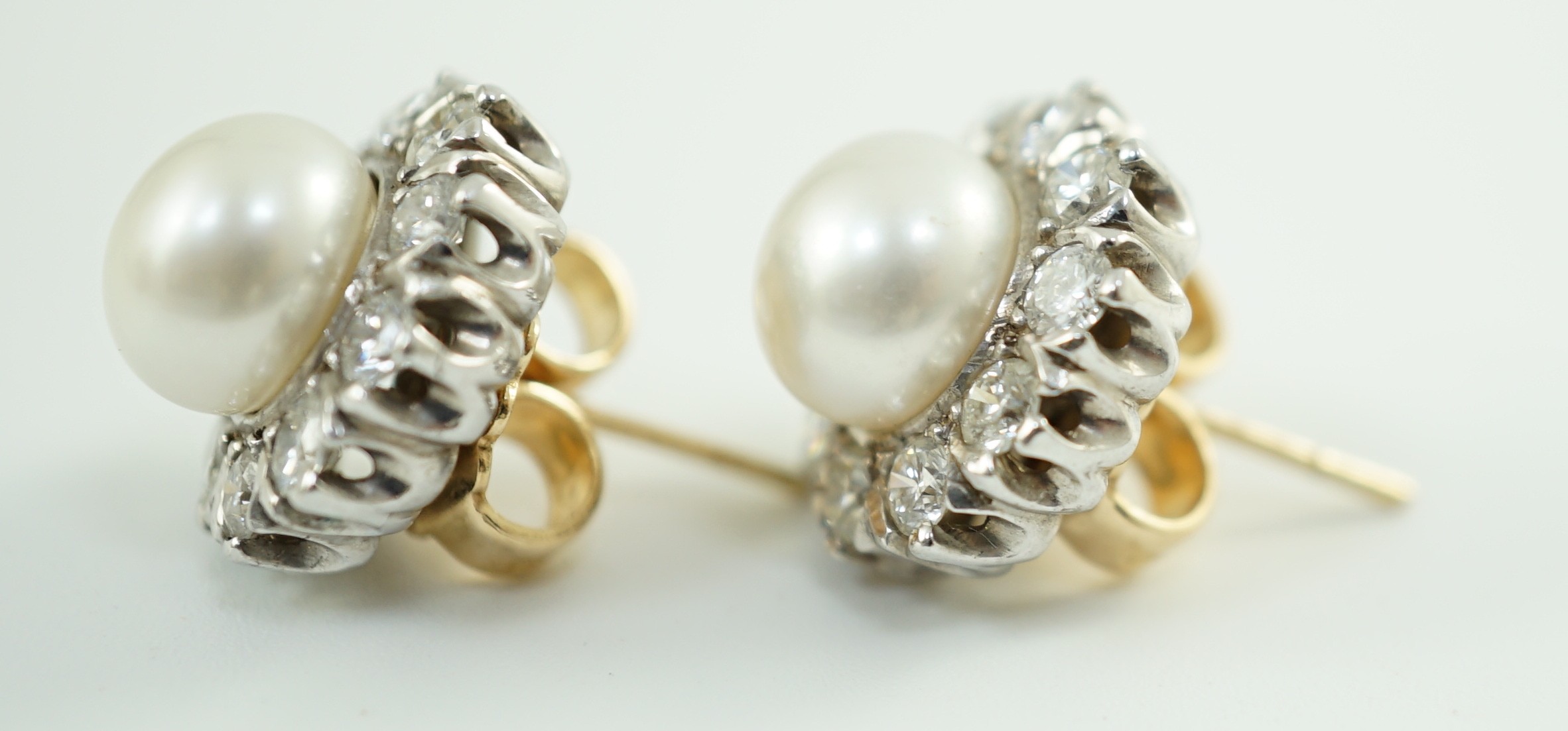 A pair of white gold? cultured pearl and diamond cluster set circular earrings